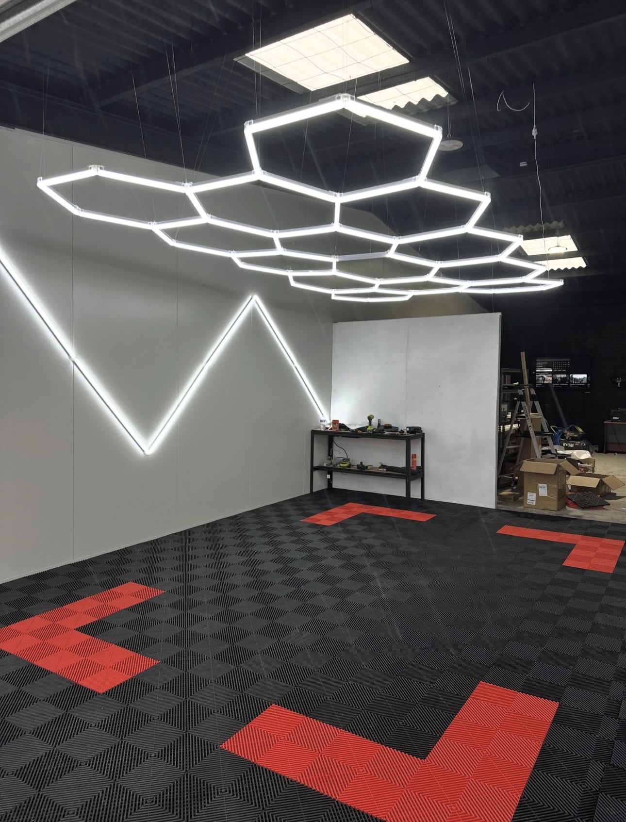Showroom with hexagonal LED lights and custom tile pattern