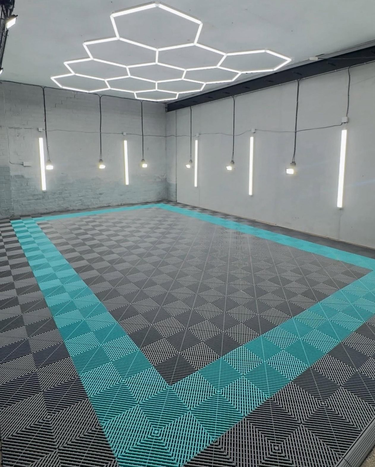 Showroom with teal border frame and grey checkerboard tiles