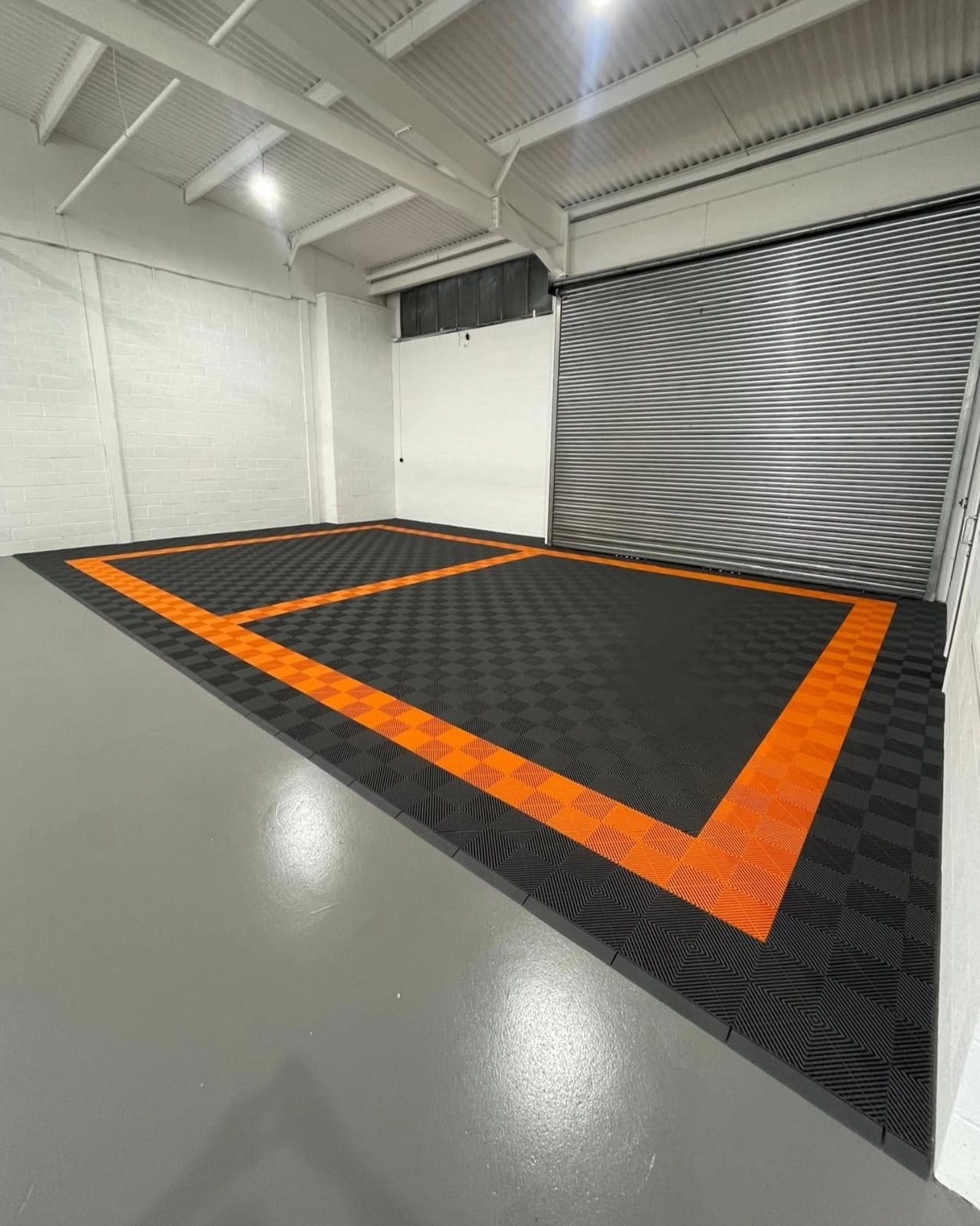 Commercial workshop with orange border frame on dark charcoal