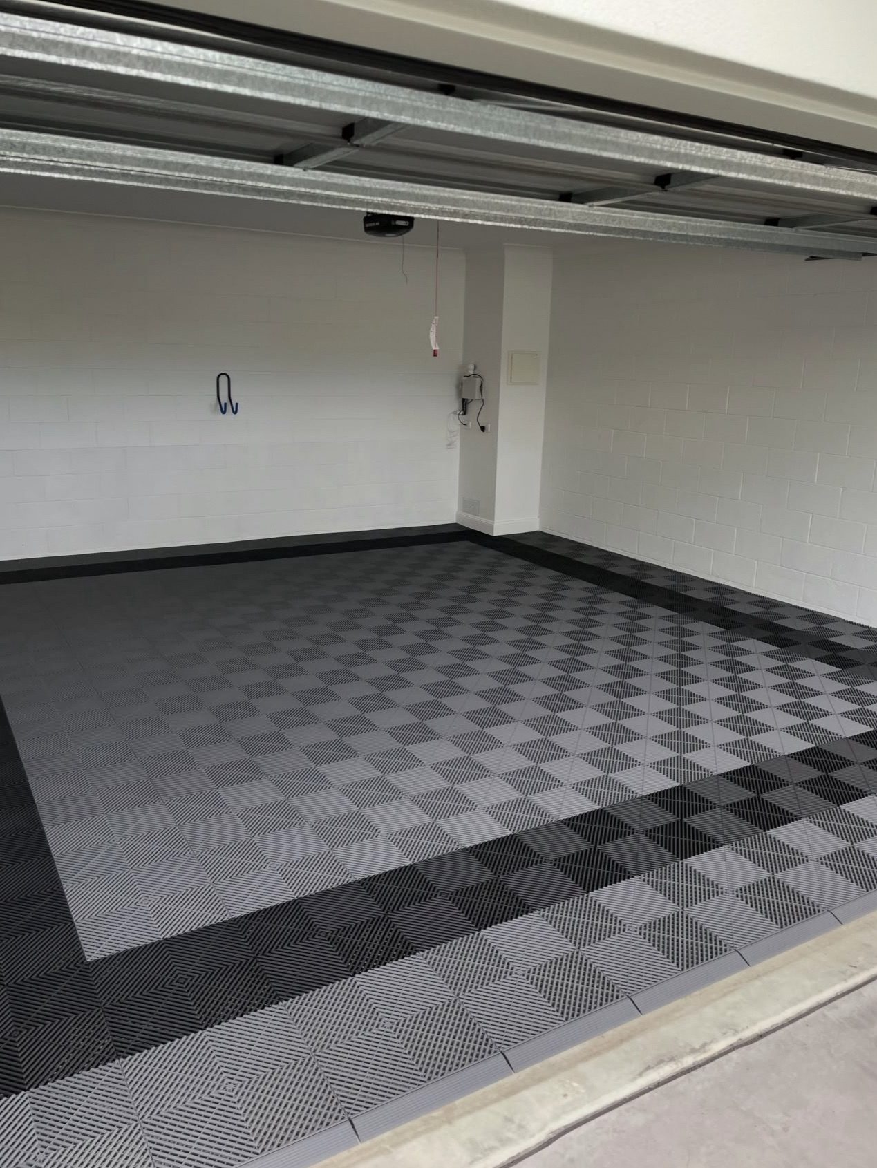 Home garage with light grey and charcoal checkerboard