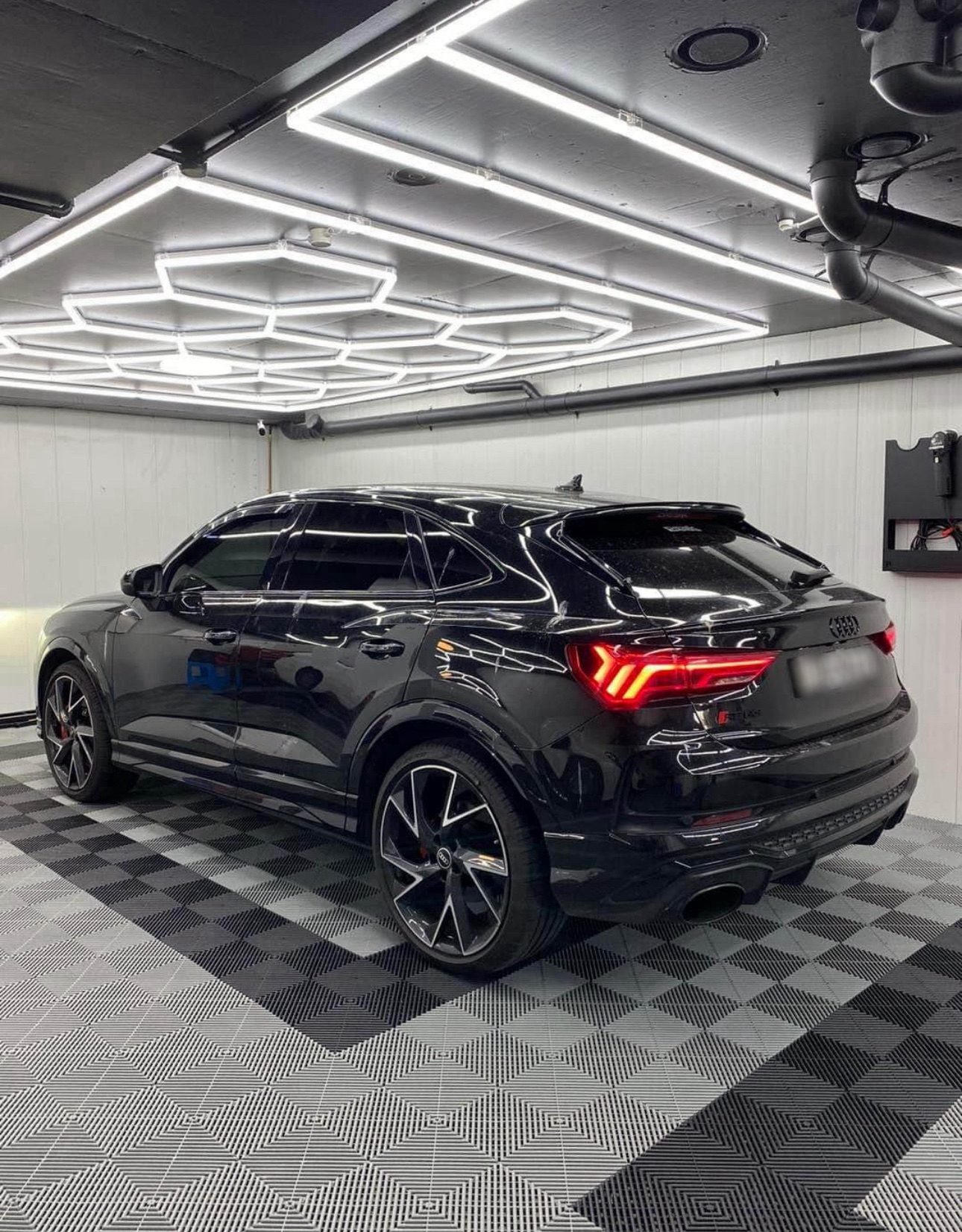 Workshop with black tile floor